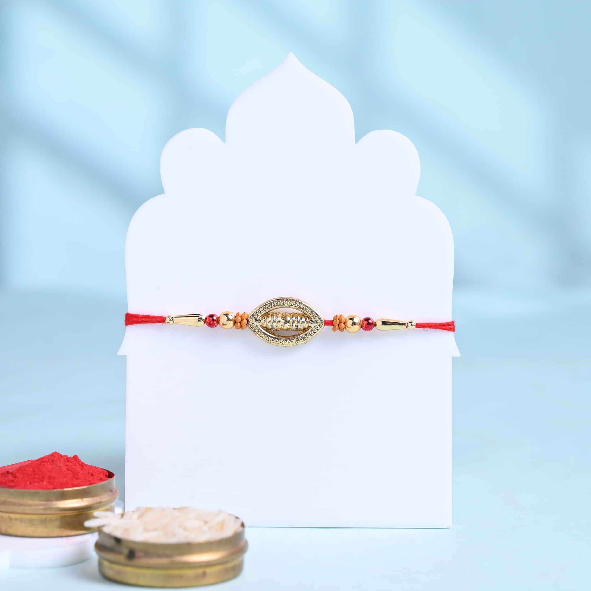 Golden Spiral Rakhi With Gulab Jamun