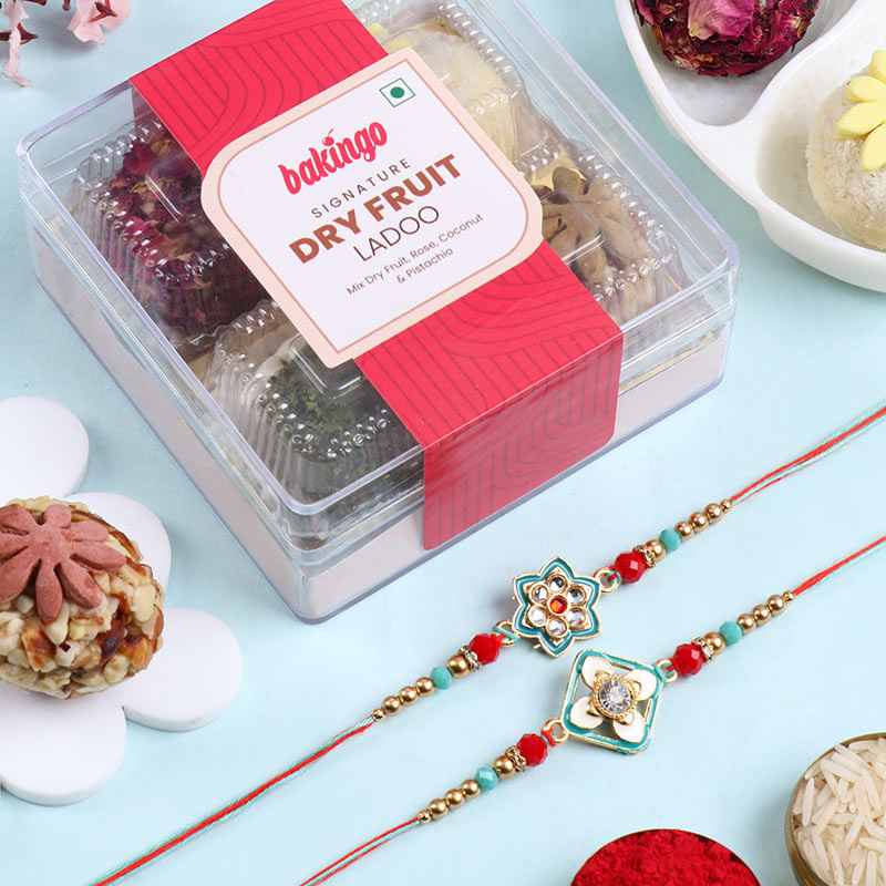 Graceful Floral Rakhi Duo With Ladoos