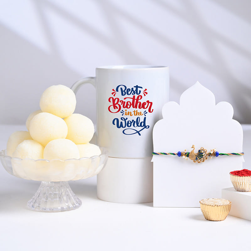 Graceful Peacock Rakhi With Rasgulla N Mug