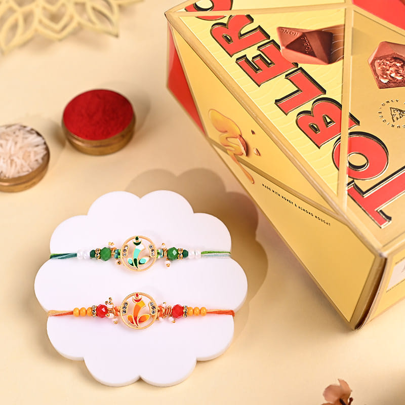 Green N Orange Ganesha Rakhis With Chocolates