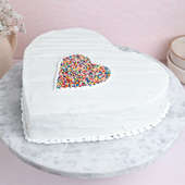 Heart shaped vibrant sprinkles vanilla cake 