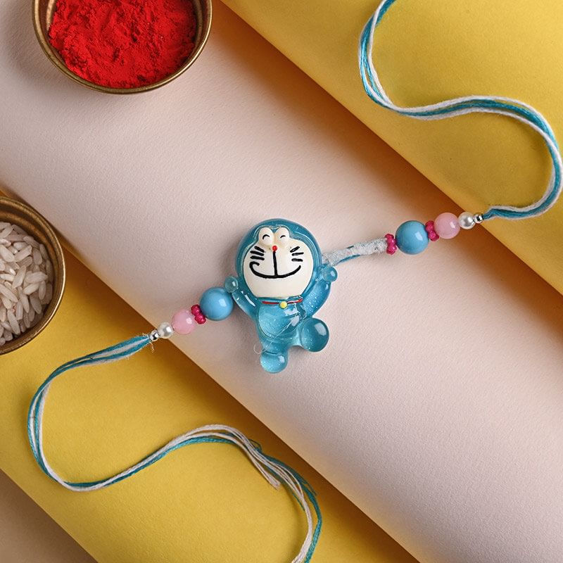 Buy Divine rakhi Online  For Brother with Dry Fruits - Stunning Silver Ganesha Rakhi N Choco Chip Cookies