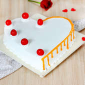 Heart Shaped Vanilla Cake With Cherries On Top