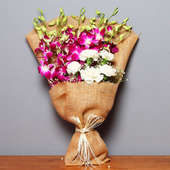 Bunch of Purple Orchids and Roses in Jute Packing