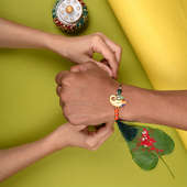 Order Ganesha Rakhi Online With Sweets For Your Brother