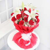 15 Red Carnations and 4 Oriental White Lilies