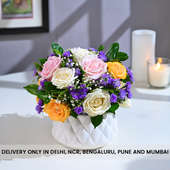 enchanting arrangement combines roses