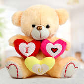A 14 inch teddy with three I Love You hearts