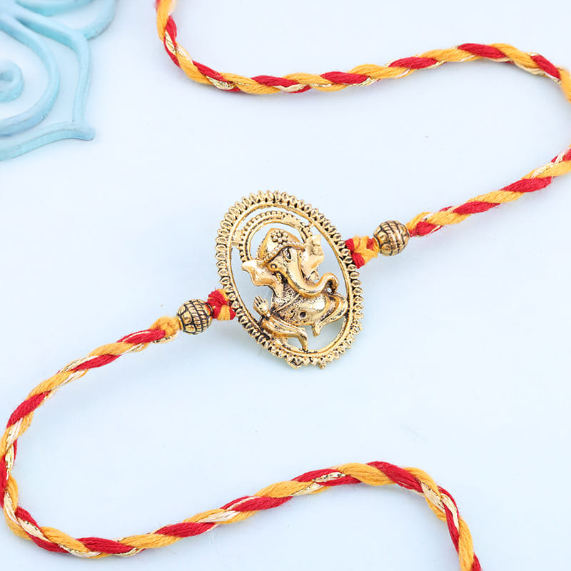 Intricate Golden Ganesha Rakhi
