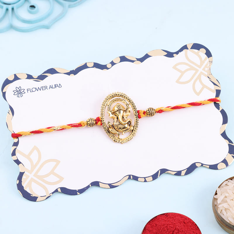 Intricate Golden Ganesha Rakhi