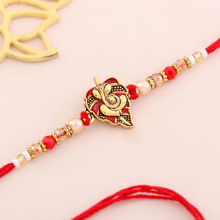 Lord Ganesha N Leaf Motif Rakhi