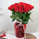 Arrangement of 20 Red Roses in a Red Glass Vase