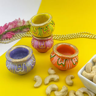 Luminous Four Diyas With Cashews