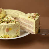Order Rasmalai Pista Cream Cake - Sliced View with Knife