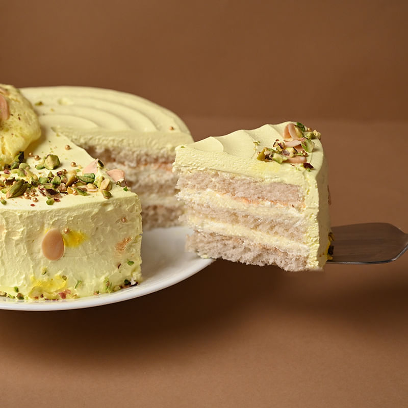 Rasmalai Pista Cream Cake - Sliced Close View with Knife