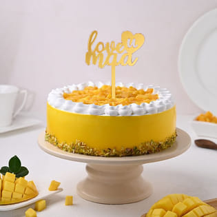 Side view of Mango Pistachio Cake With Mom Topper