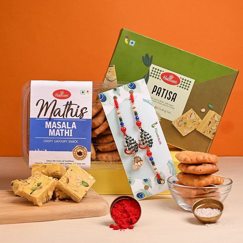 Lumba Rakhiwith Sweets for Bhaiya bhabhi Online Delivery - Crunchy Masala Matthi N Patisa With Peacock Bhaiya Bhabhi Rakhis