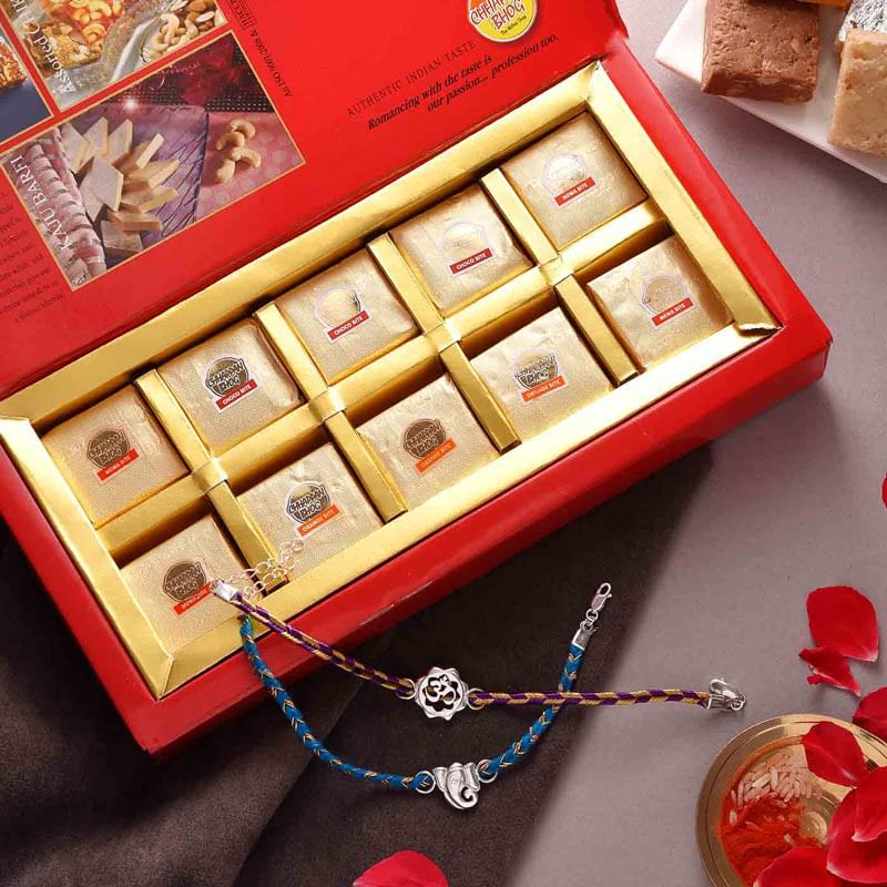 Mawa bites With Pure Silver Om N Ganesha Rakhi Duo 