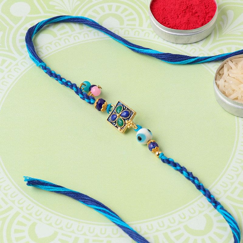 Mesmerising Blue Floral Dial Rakhi 
