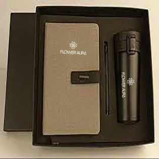 Black and white notebook and a black bottle