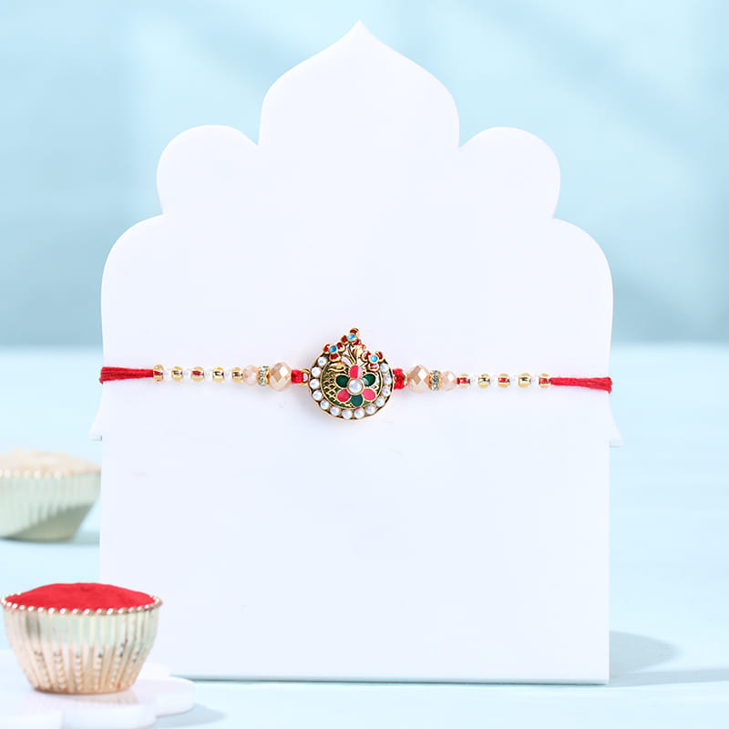Silver Ganesha Rakhi With Almond Rocks