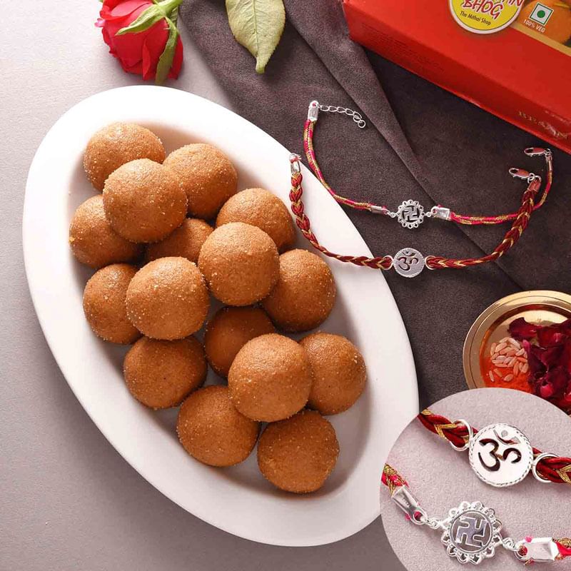 Om Holy Silver Rakhi Duo With Besan Ladoo