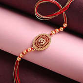 Order Divine rakhi Online For Brother - Om Stone Engraved Pearl Rakhi