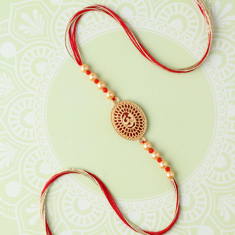Buy Om Stone Engraved Pearl Rakhi - Online Divine rakhi For Brother