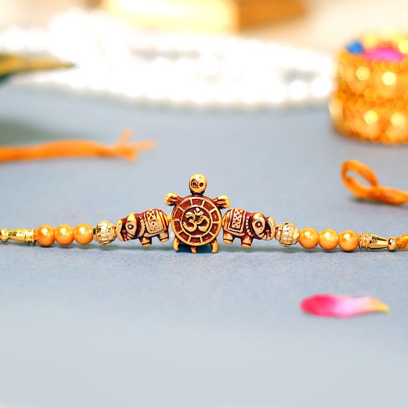 Om Turtle Beads Rakhi - A Fancy Rakhi - Order Online Now
