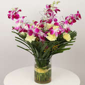 Orchids Carnations Glass Vase With Cake:Online Cake And Flower Delivery