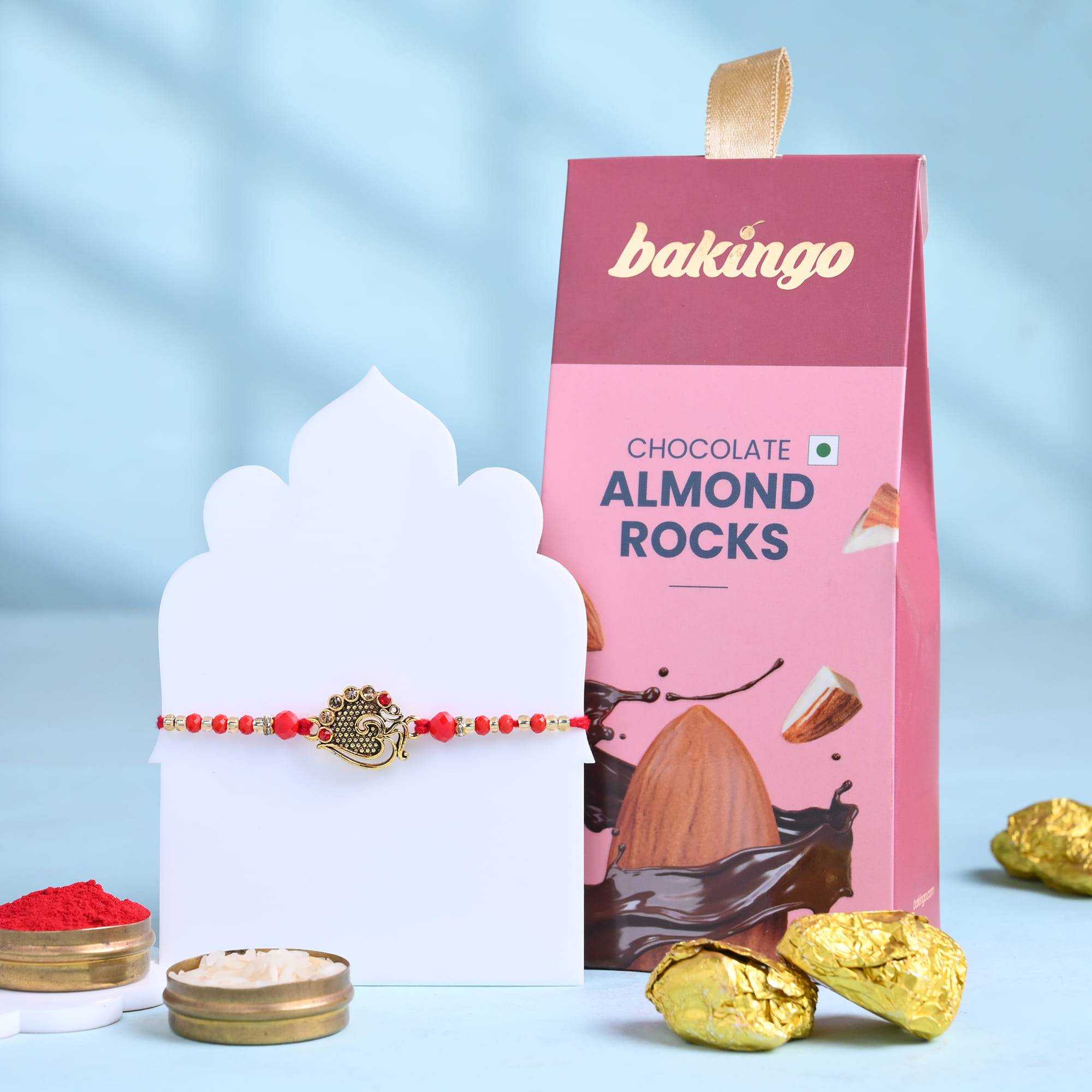Ornate Om Rakhi With Almond Rocks