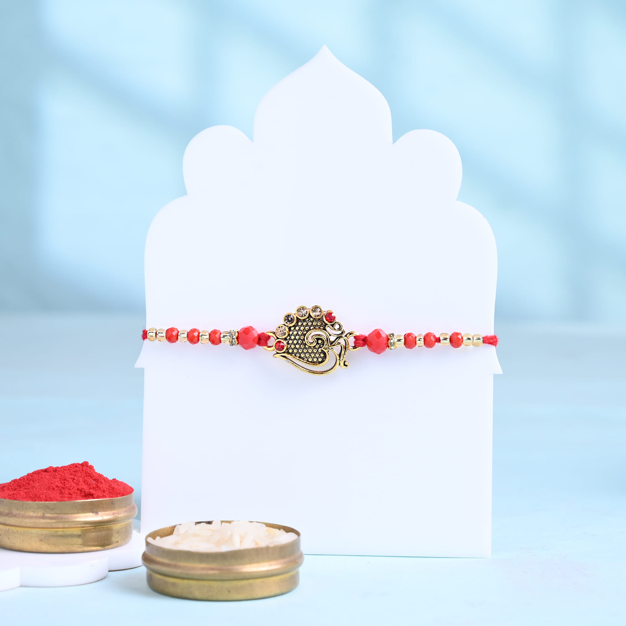 Ornate Om Rakhi With Gourmet Dryfruits