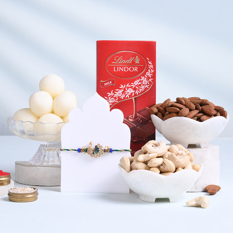 Ornate Peacock Rakhi With Sweets N Nuts