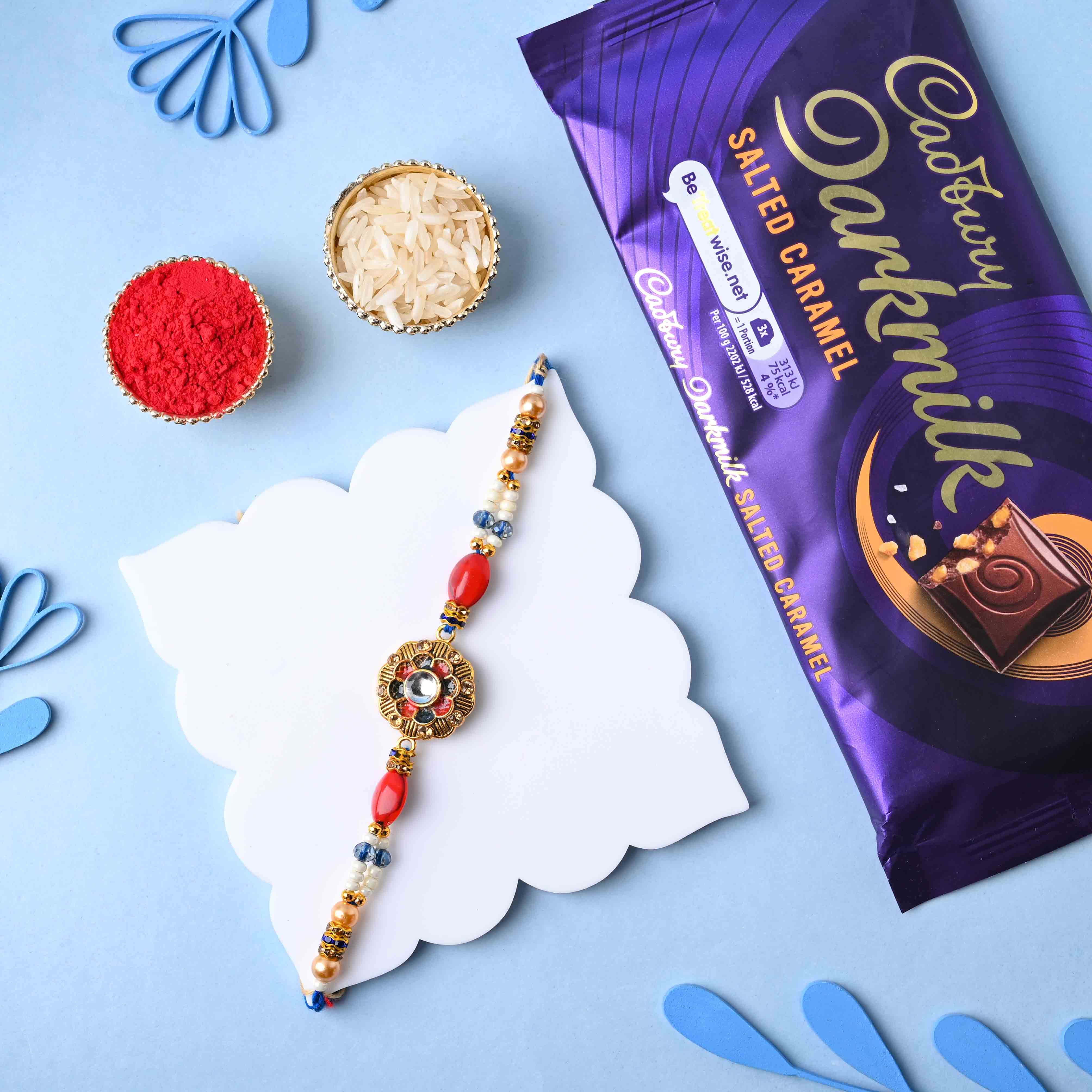 Ornate Stone Rakhi With Cadbury Dark Milk Caramel Bar