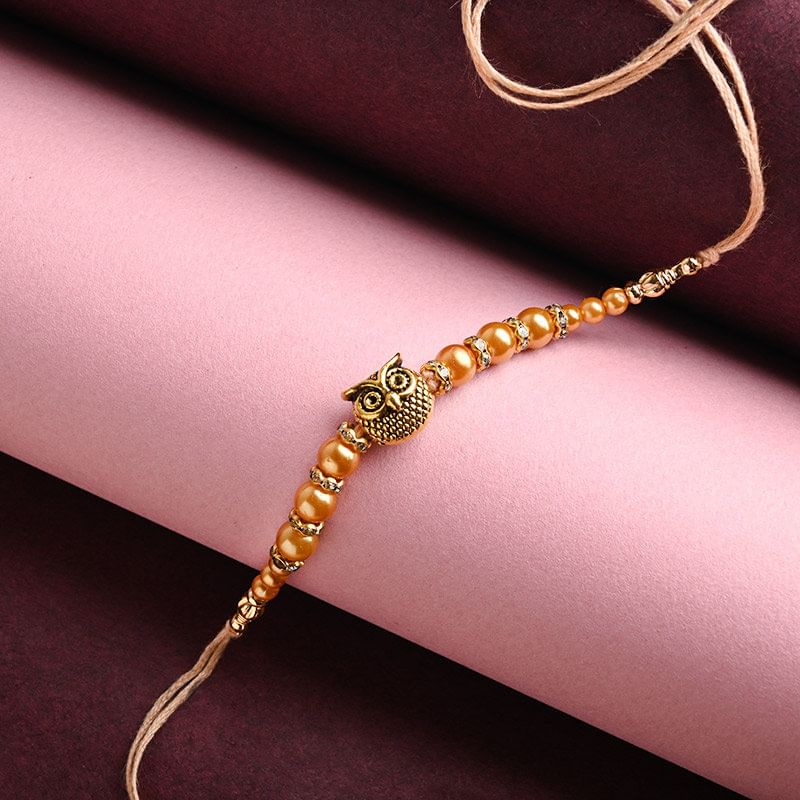Order Fancy rakhi Online For Brother - Oxidised Owl Pearl Rakhi