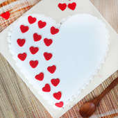 Heart Shaped Vanilla Cake With Hearts On It - Top View