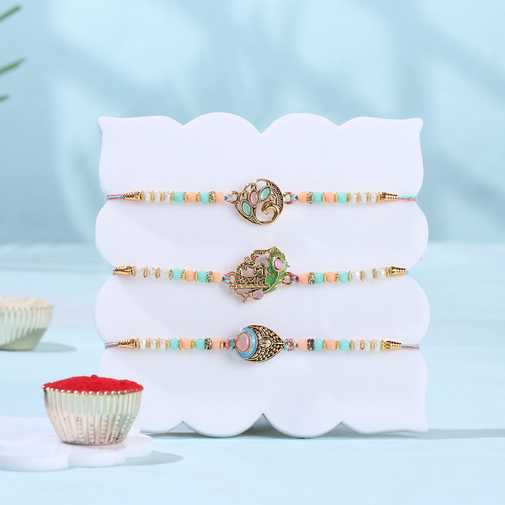 Pastel Divine Rakhi Trio With Savoury Treats