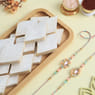 Pastel Elegance Rakhi Duo With Kaju Katli