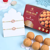 Pastel Floral Rakhi Duo With Besan Ladoos