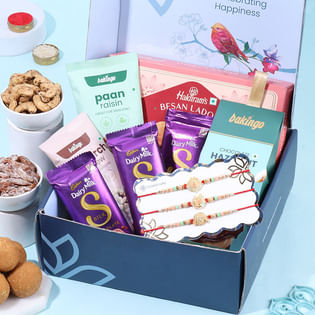 Pastel Rakhi Trio N Gourmet Treats Hamper