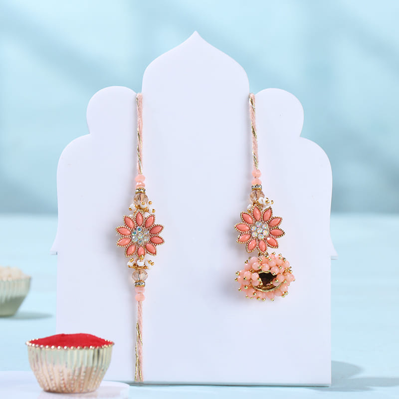 Peach Floral Bhai Bhabhi Rakhi With Ragullas