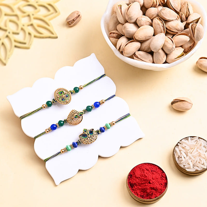 Peacock Charm Rakhi Trio With Pistachios