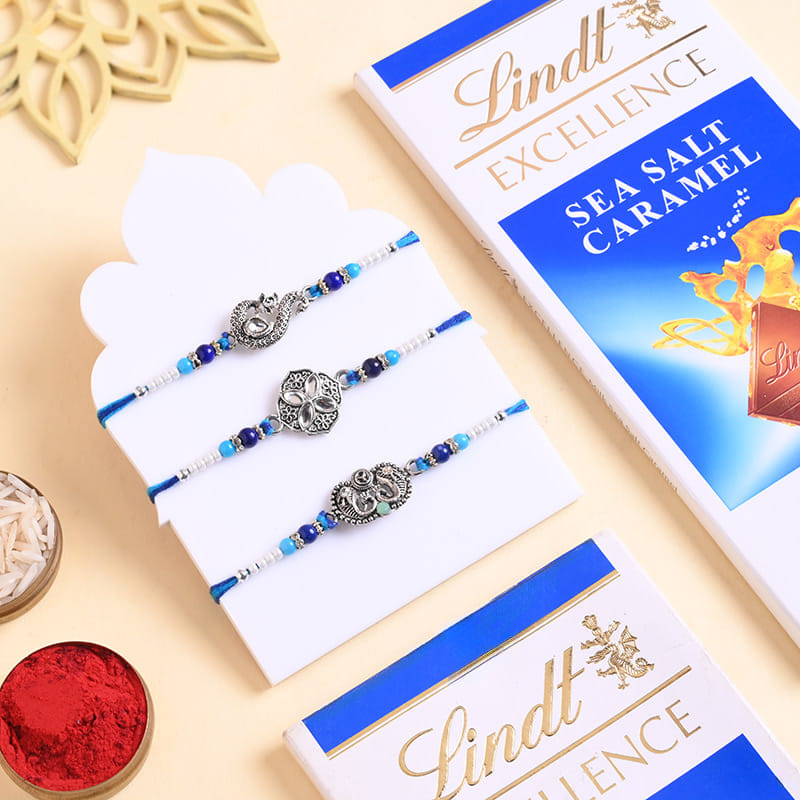 Peacock N Floral Rakhi Trio With Chocolates