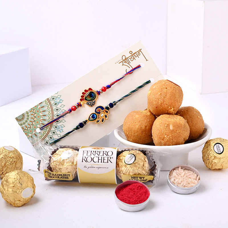 Send Peacock Rakhi Duo With Ferrero Rocher N Besan Ladoo to Canada