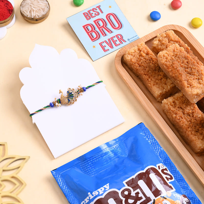 Ornate Peacock Rakhi With Sweets N Choco Treats