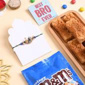Ornate Peacock Rakhi With Sweets N Choco Treats