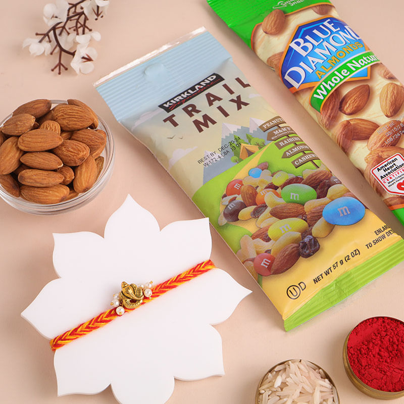 Sacred Golden Ganesha Rakhi With Nutty Treats
