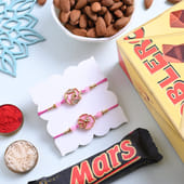 Pink Blossom Rakhi Duo N Sweet Crunch Hamper