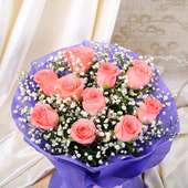 Top view of Bouquet of 10 Pink Roses in Purple Paper