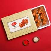 Order Fancy Rakhi for Brother with Sweets - Authentic Pinni n Baked Cashews With Oxidised Mandala Rakhi